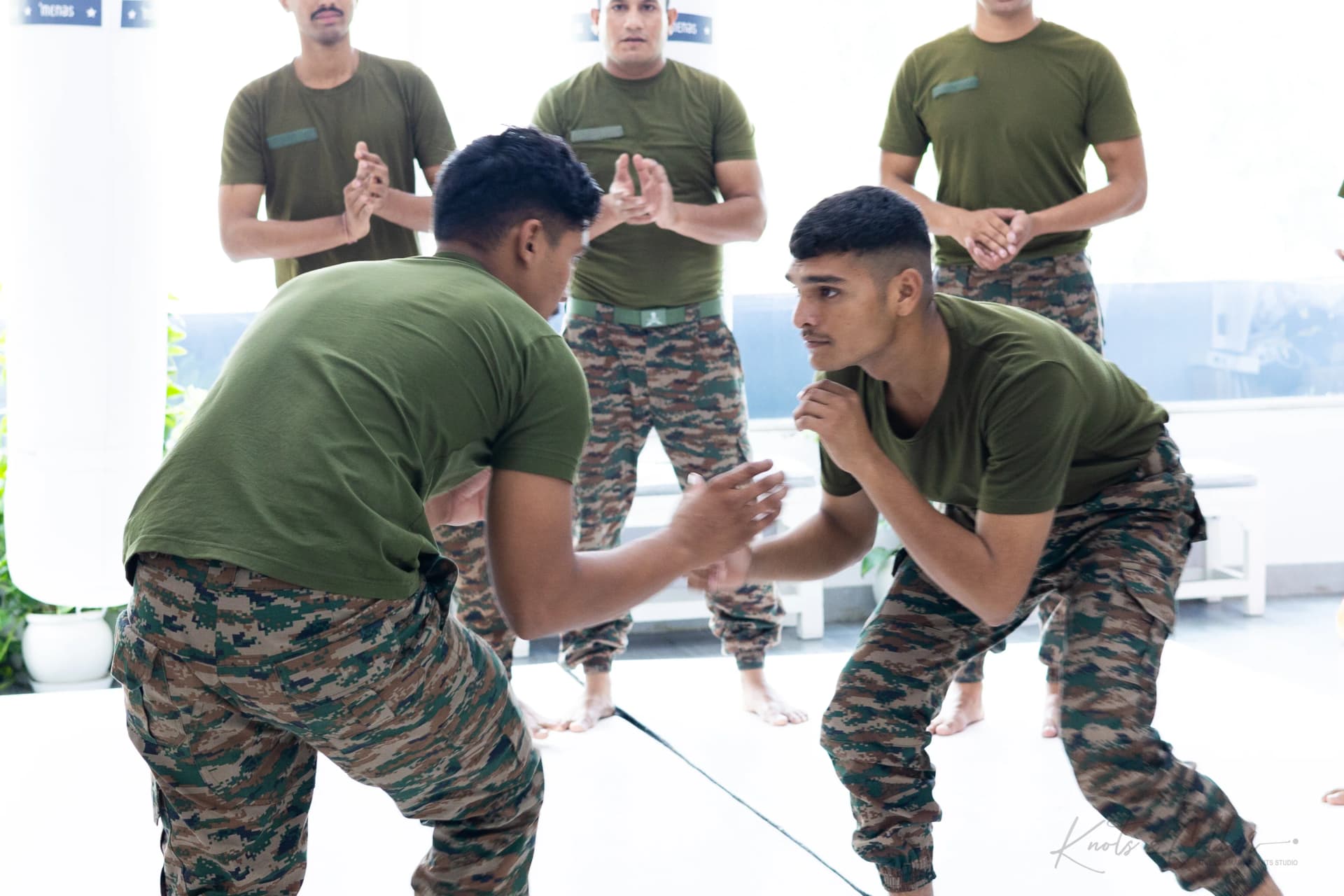 Soldiers practising an arm drag during close-quarters self-defence training at Knots & Collar, New Delhi