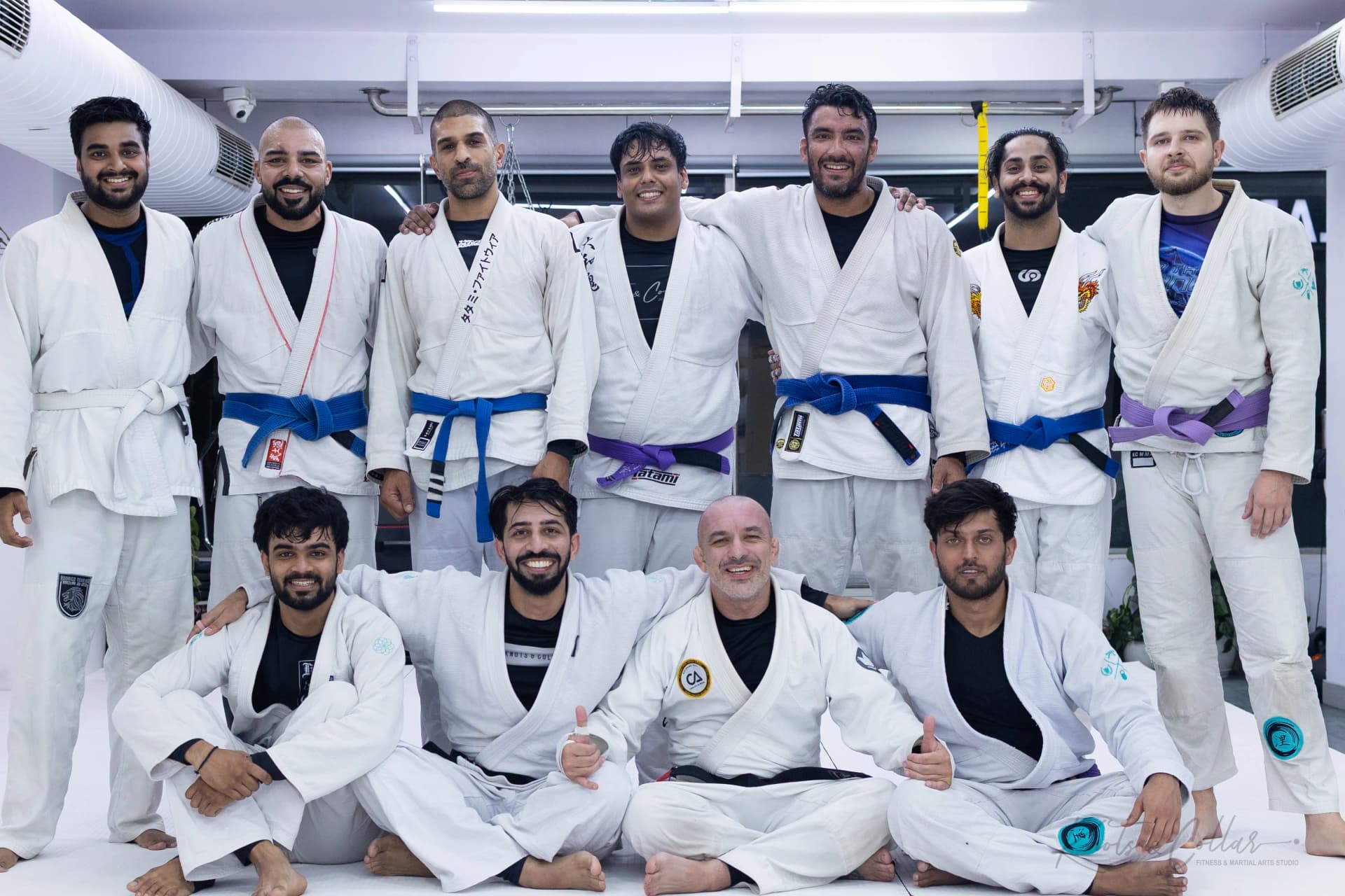 Blue, purple and white belt students together after a Jiu-Jitsu seminar in New Delhi