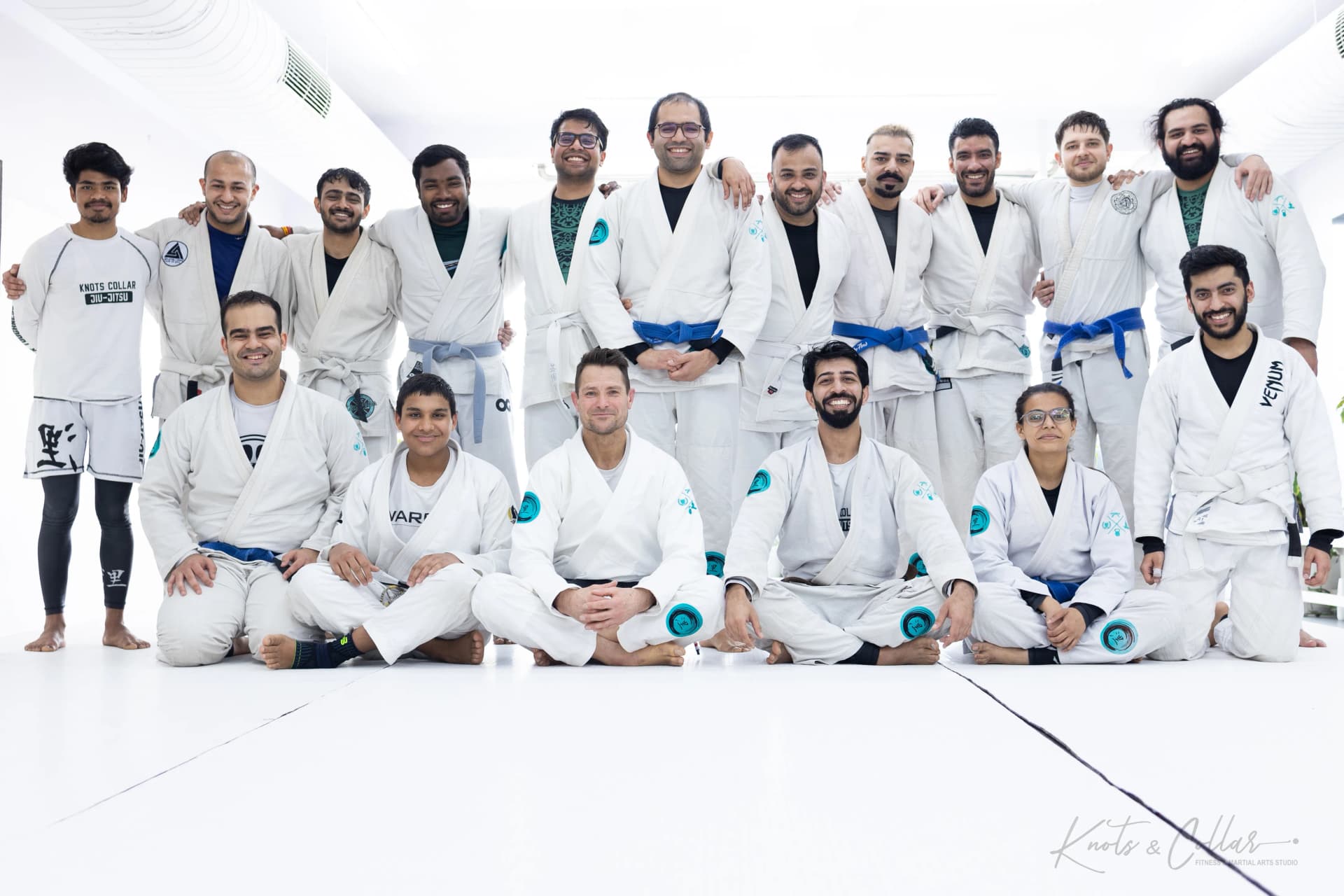 White and blue belt students with a visiting instructor after a seminar at Knots & Collar, New Delhi