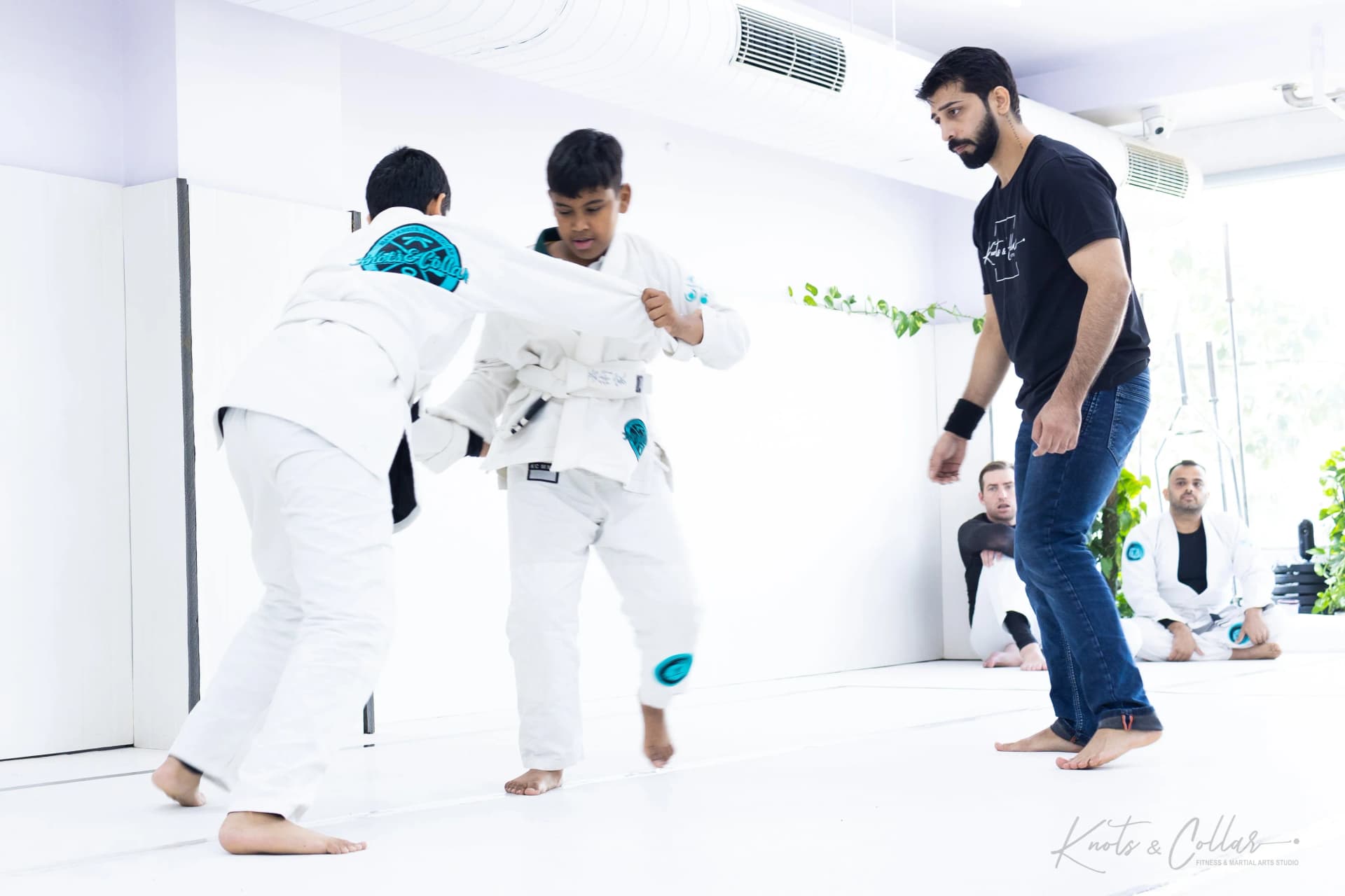 Young jiu-jitsu students together after a kids session at Knots & Collar, Defence Colony