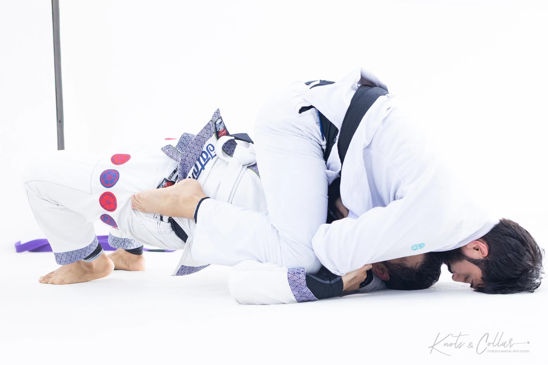 Professor Binish Sukhija rolling during BJJ sparring session at Knots and Collar New Delhi