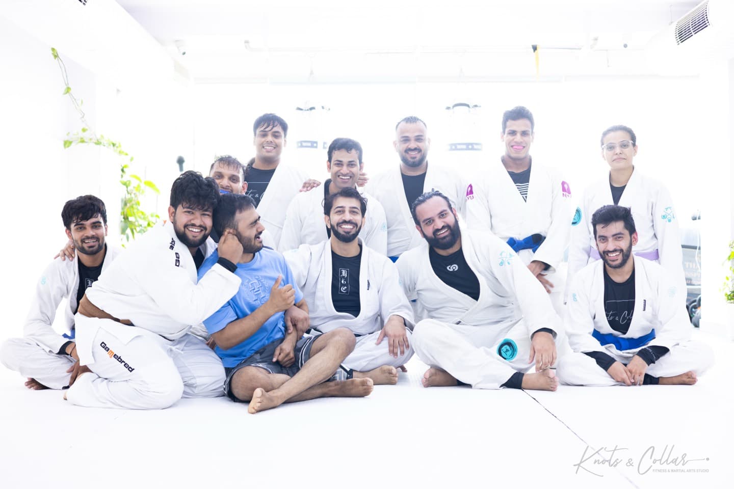 The Knots & Collar community together after a gi jiu-jitsu class at the studio in Defence Colony