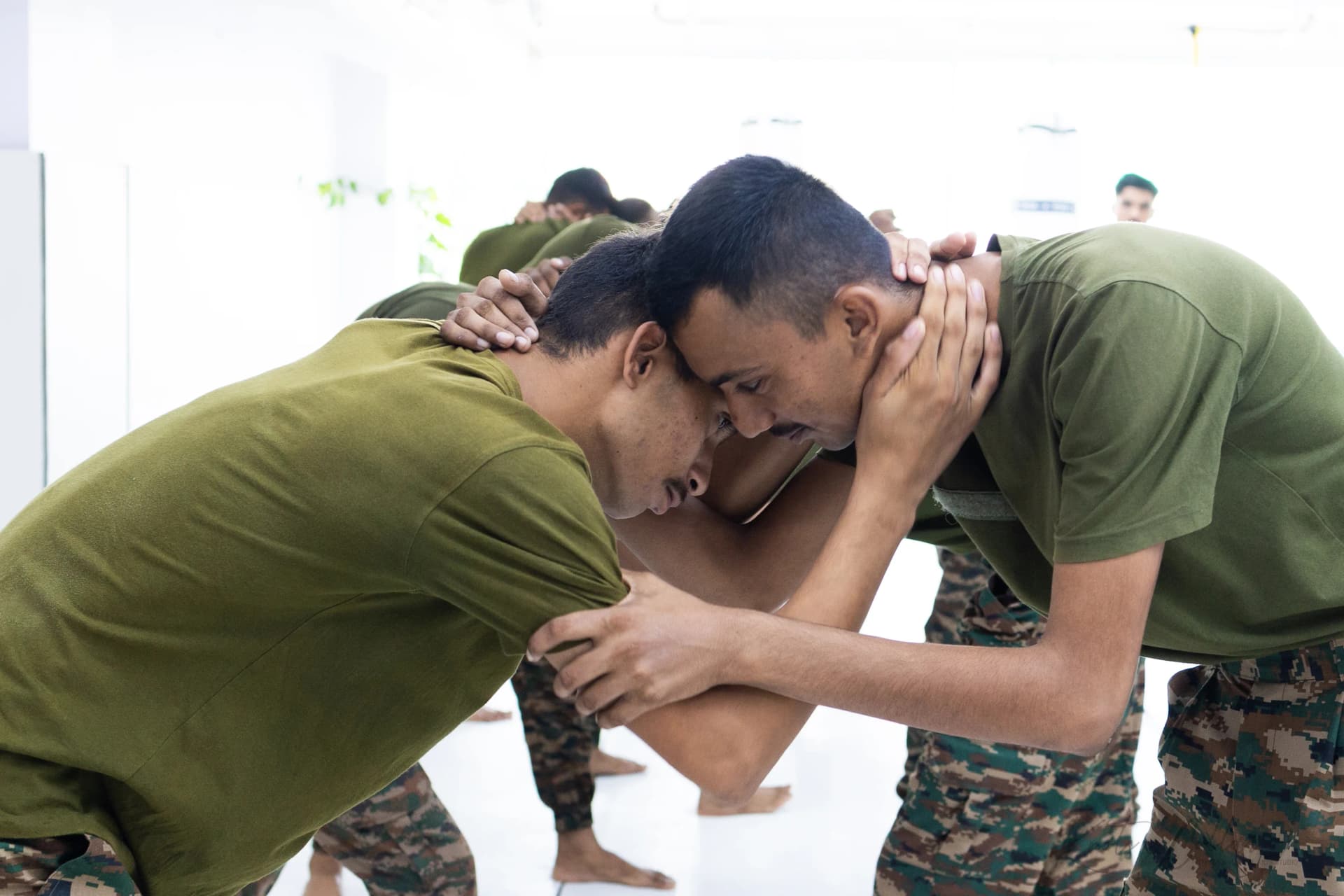 Armed forces personnel working ground control during a grappling session at Knots & Collar, New Delhi