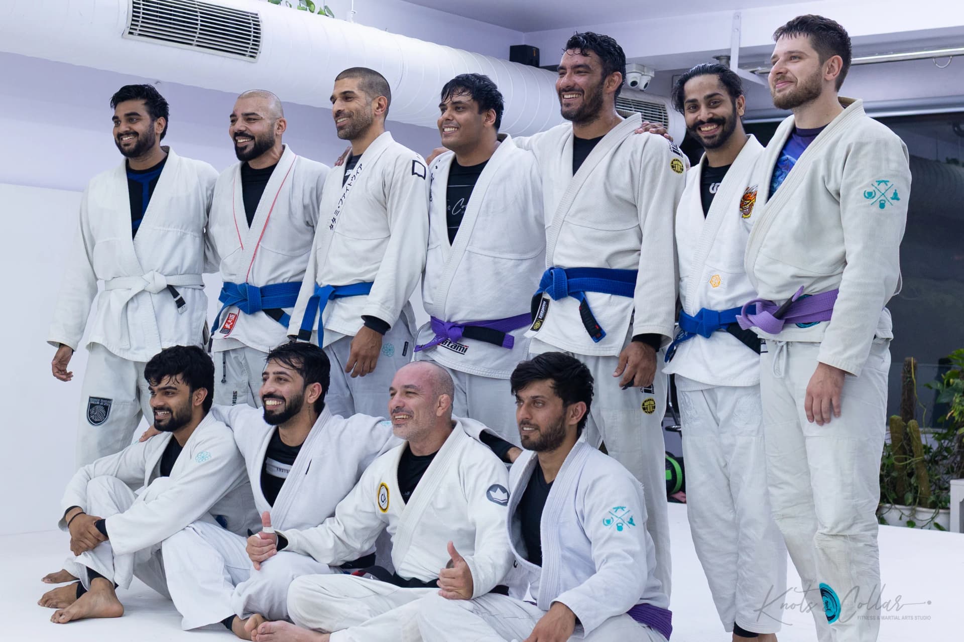 Adult students seated on the mat after a Jiu-Jitsu seminar at Knots & Collar, New Delhi