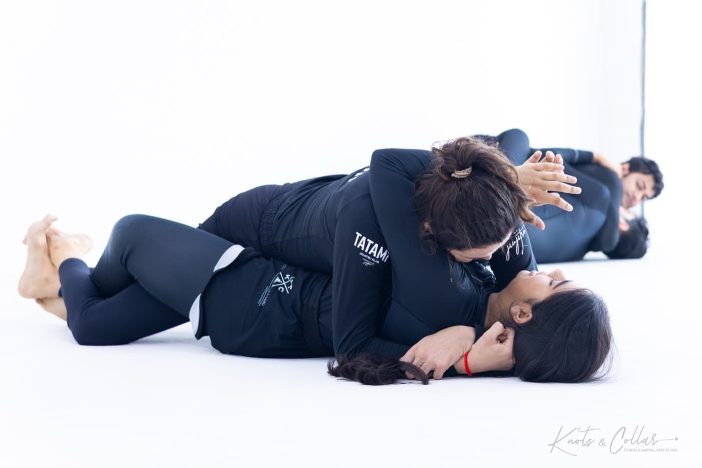 Two women training no-gi jiu-jitsu together at Knots & Collar, New Delhi
