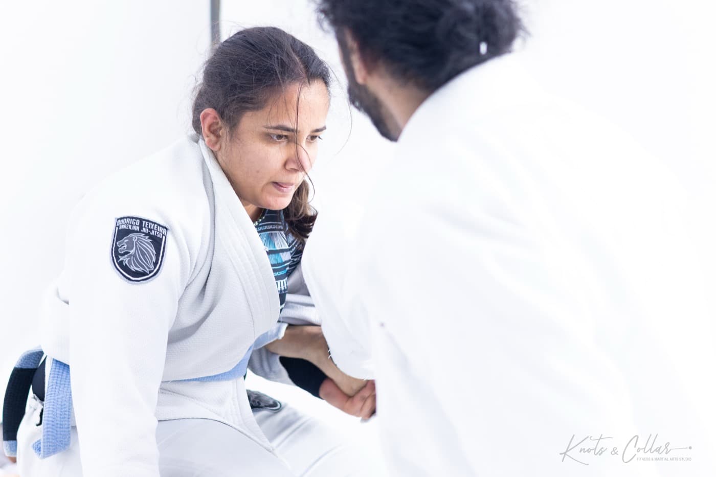 A woman training gi jiu-jitsu with a coach at Knots & Collar, New Delhi